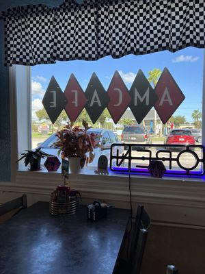 A.M. Cafe window sign and seating